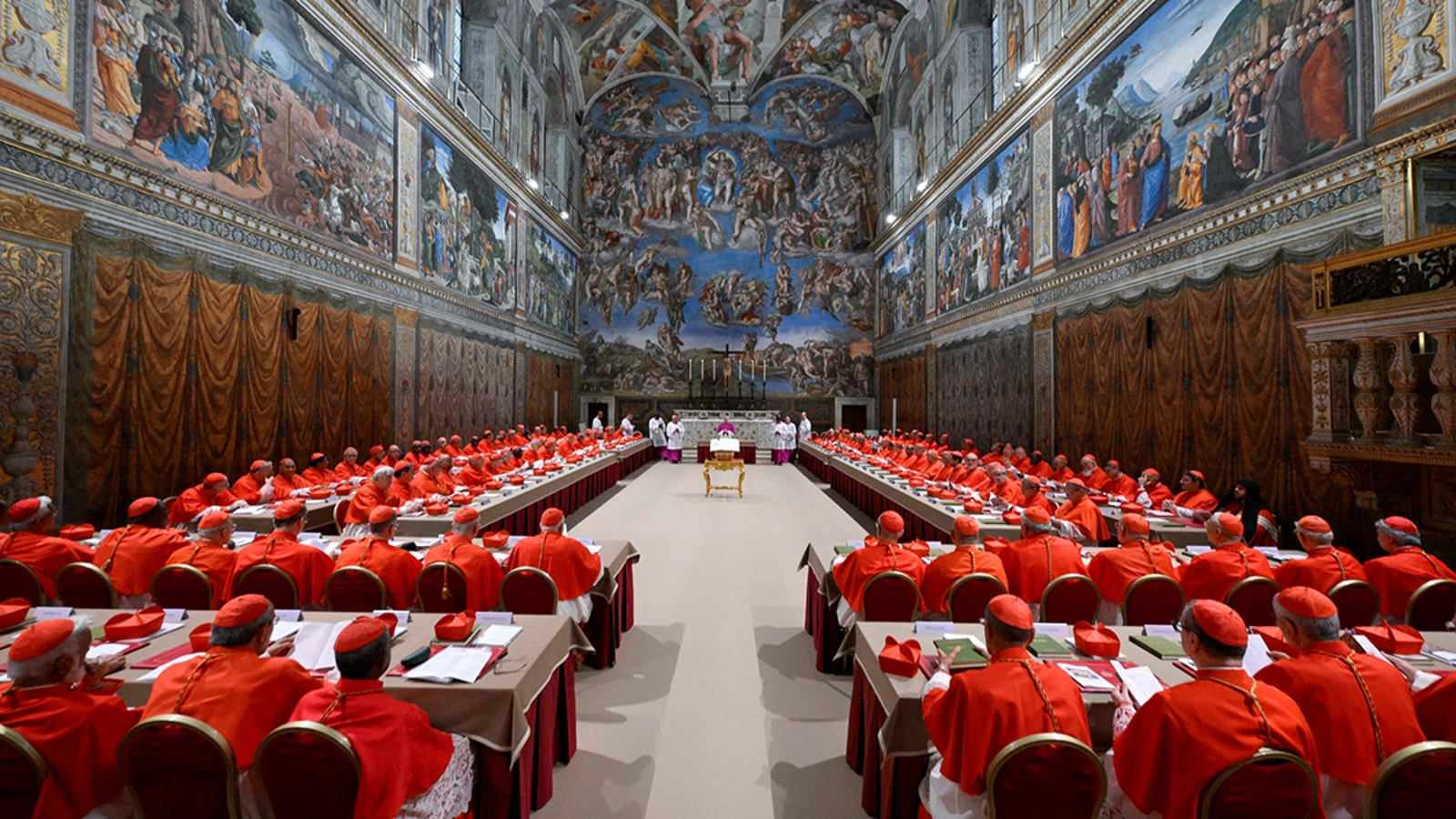 Sistine Chapel prepared for a Papal Conclave with red drapery and chairs